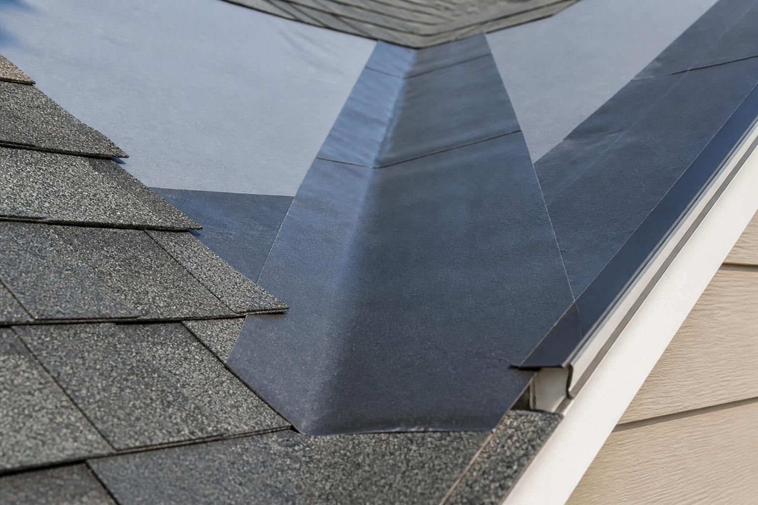 Waterproof barrier installed along a roof edge and valley.
